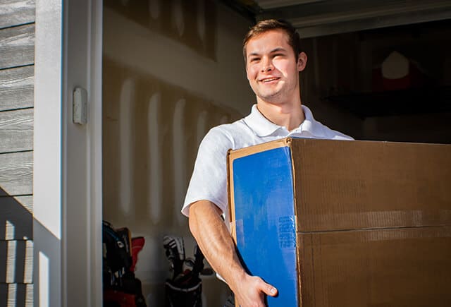 junk removal ulster county employee loading a box